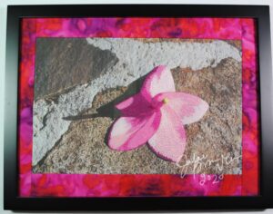 pink flower on stone thread painting